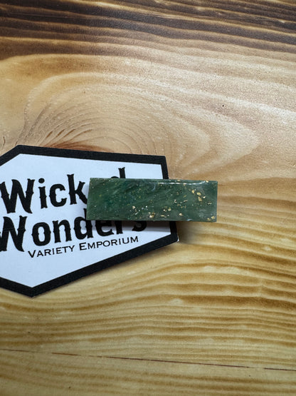 Green with gold hair clip