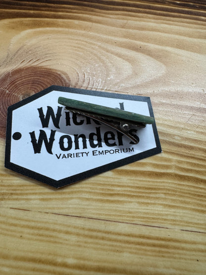 Green with gold hair clip